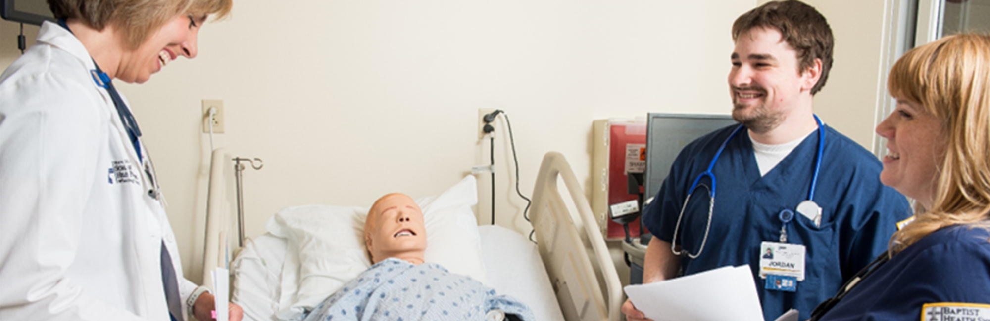 student nurse working on dummy patient